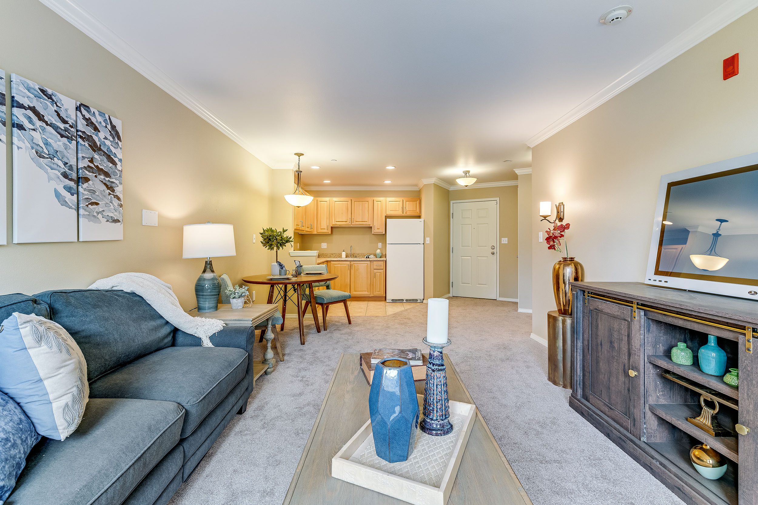 model bedroom with living room and kitchen