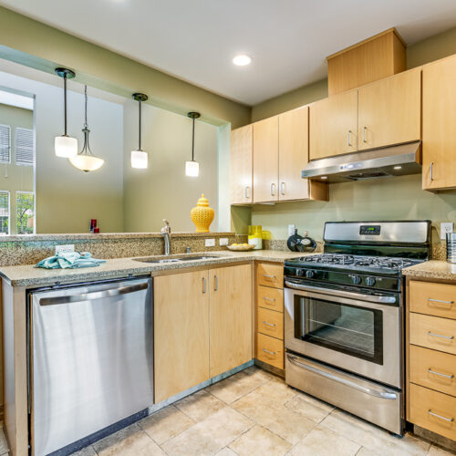 Full kitchen with stainless steel appliances in cottage