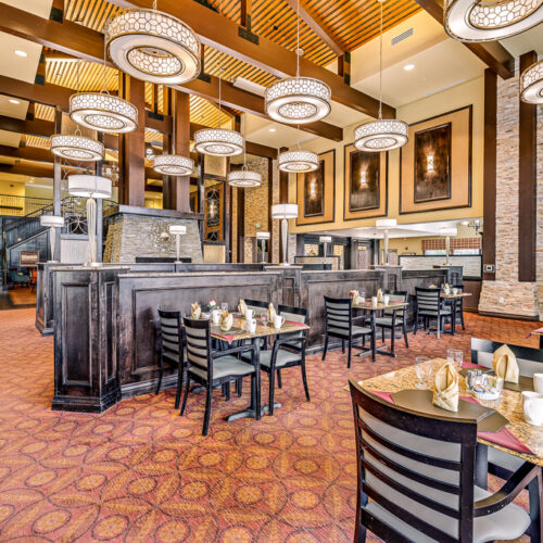 Dining room with high ceilings and tables